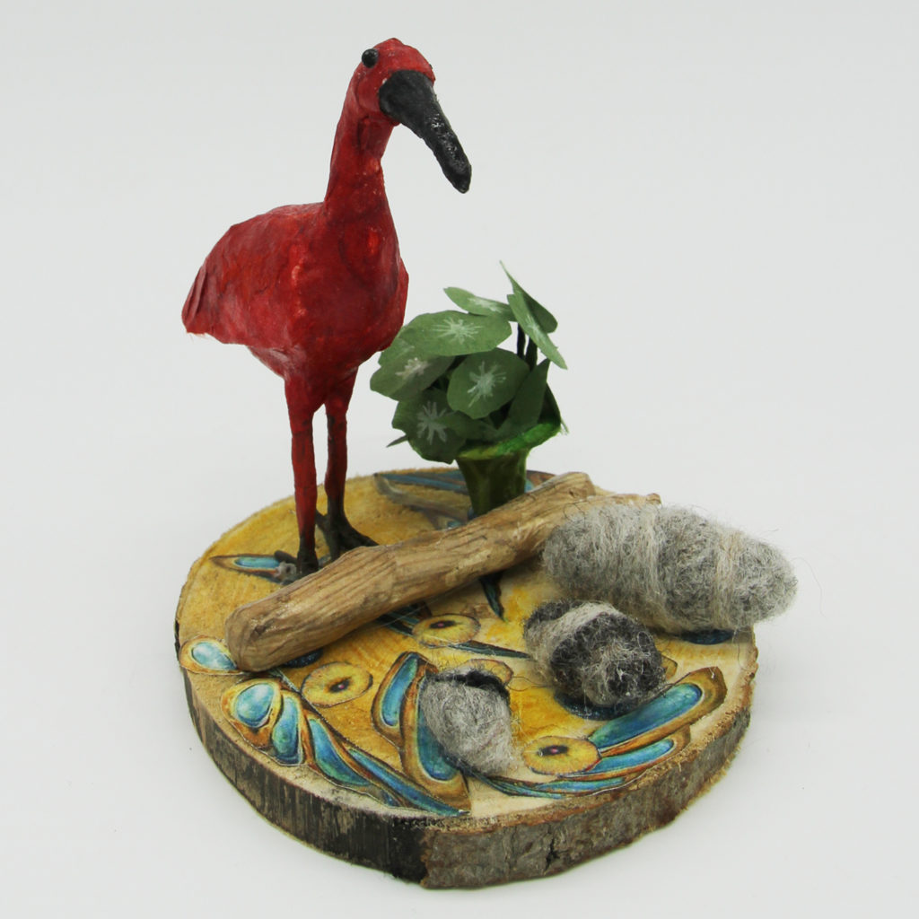 Scène au bord de l'eau : l'ibis rouge